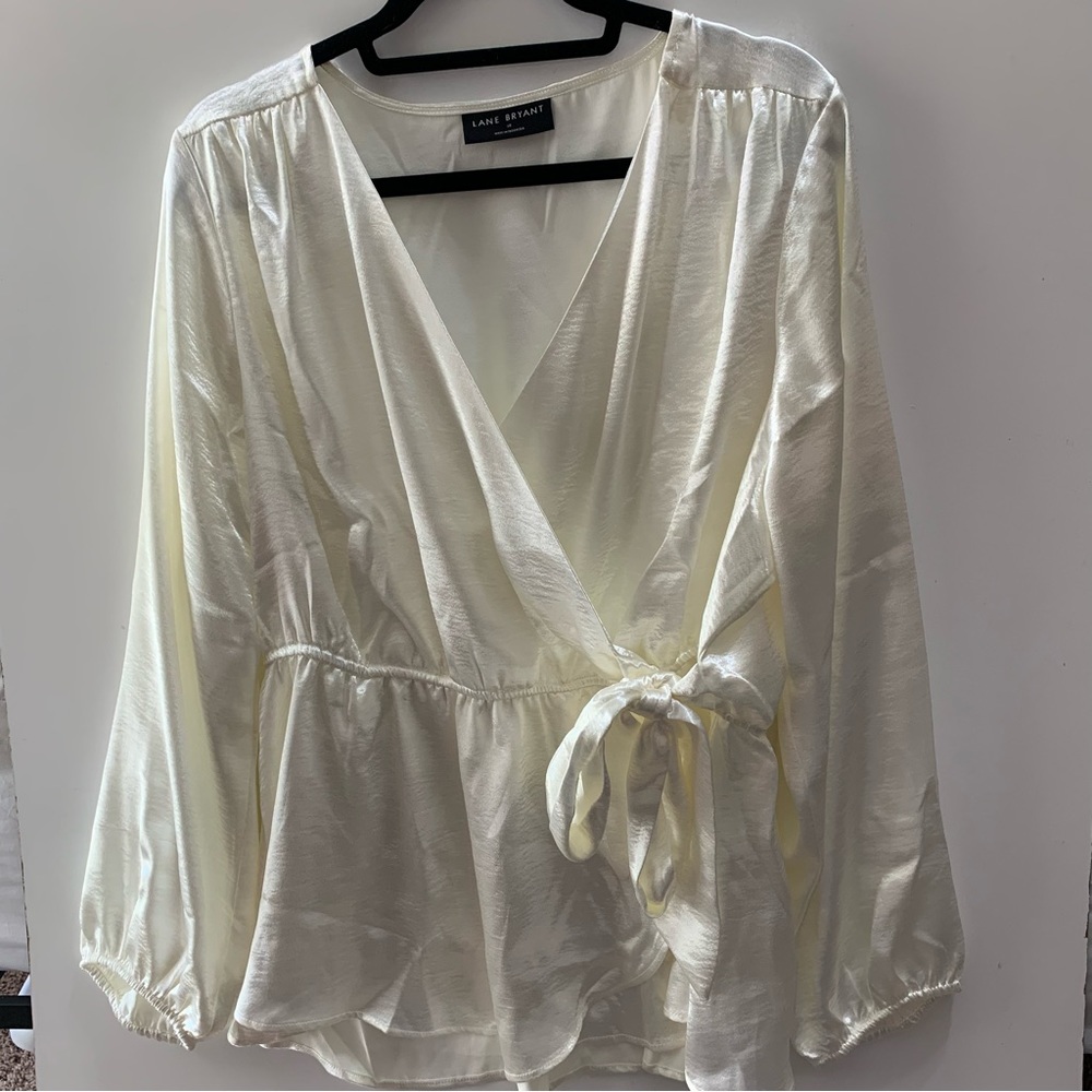 Woman’s cream Lane Bryant  size 18 shiny wrap blouse